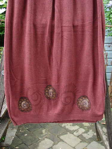 1997 Cotton Cashmere Skirt Pinwheel Marled Stained Glass Size 2 displayed on a clothesline, showcasing its full elastic waistband, deep side pockets, and thinly ribbed hem.