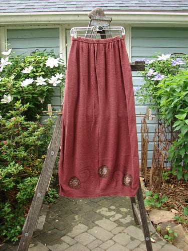 1997 Cotton Cashmere Skirt Pinwheel Marled Stained Glass Size 2, displayed on a wooden ladder, highlighting the full elastic waistband, deep side pockets, and thinly ribbed hem.