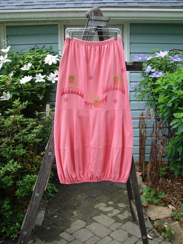 1997 Promenade Skirt Wave Shell Tulip Size 1 displayed on a wooden ladder, featuring double segmented horizontal accent seams and two inseam deep side pockets, emphasizing its organic cotton fabric and elastic gathered hem.
