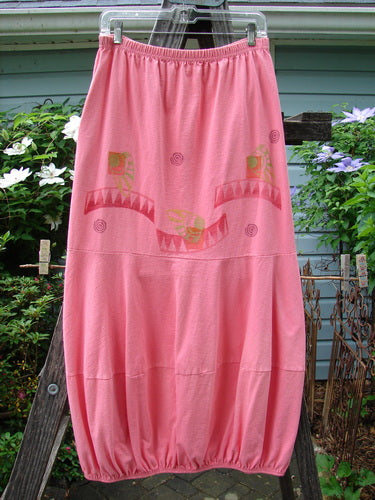 1997 Promenade Skirt Wave Shell Tulip Size 1 displayed on a wooden ladder, featuring double segmented horizontal accent seams, full elastic waistline, gathered hem, and deep side pockets with a signature wave shell pattern.