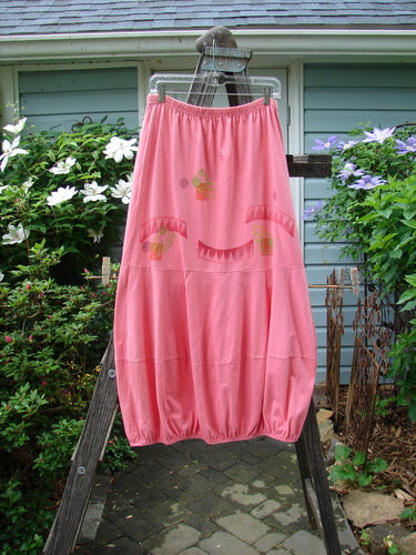 1997 Promenade Skirt Wave Shell Tulip Size 1 displayed on a wooden ladder, showcasing its full elastic waistline, double segmented horizontal accent seams, elastic gathered hem, and signature wave shell theme paint.