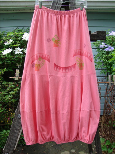 1997 Promenade Skirt Wave Shell Tulip Size 1 displayed on a wooden ladder, showcasing its full elastic waist, double segmented horizontal seams, gathered hem, and deep side pockets.