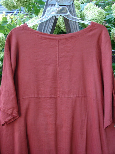 Barclay Linen Viscose Vented Urchin Dress Unpainted Brick Stripe Size 2 displayed on a hanger, featuring a softer V neckline, three-quarter sleeves, curved empire waist, and varying A-line shape.