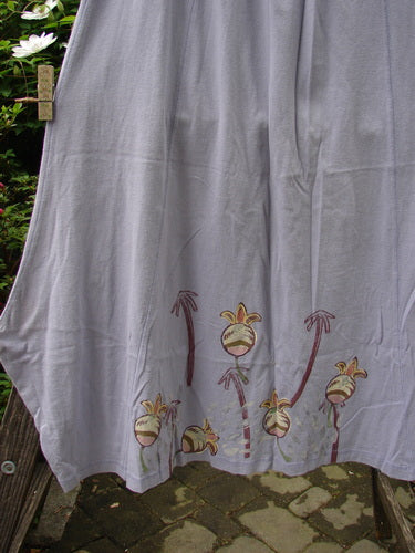1998 Botanicals Gillyflower Skirt Bud Wisteria Size 2 hanging on a clothesline, showcasing its elastic waist, curvy seams, and botanical garden bud design.