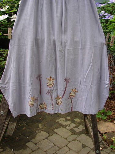 1998 Botanicals Gillyflower Skirt Bud Wisteria Size 2 displayed on a clothesline, showcasing floral design and unique sectional curvy seams.