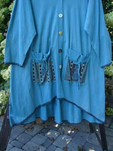 Barclay Cotton Hemp Contrast Tie Pocket Jacket Seahorse Watercolor Size 2, featuring a rounded neckline, full button front, two exterior pockets, contrasting hem, and a unique seahorse theme paint design.