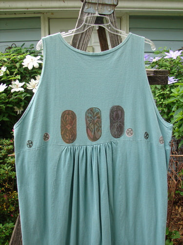 1993 Button Jumper Vintage Carved Stone Ocean Size 2 featuring a blue tank top with intricate designs, wider V neckline, deeper arm openings, and vintage buttons accenting tunnel pockets, perfect condition.
