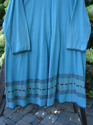 Barclay Cotton Hemp Contrast Tie Pocket Jacket Seahorse Watercolor Size 2 displayed on a wooden pole, showcasing its rounded neckline, full button front, and two exterior painted pockets.