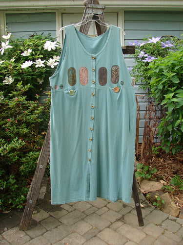 1993 Button Jumper Vintage Carved Stone Ocean Size 2 displayed on a rack, featuring a wider V neckline, deeper arm openings, tiny wooden buttons, and oversized vintage buttons on tunnel pockets.