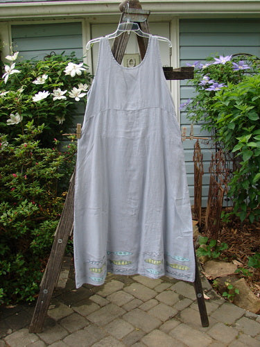 1999 Handkerchief Linen Sunbeam Dress Fish Water Size 1 displayed on a wooden rack, featuring a full-length sweeping skirt, empire waist seam, and sectional panels with a fish theme paint.