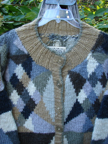 Tara Handknits Diamond Button Oversized Cardigan Geometric Naturals OSFA features hand-knit argyle patterns in bulky wool, with ribbed crew neck, button-up front, and long sleeves, showcasing a vintage geometric design.