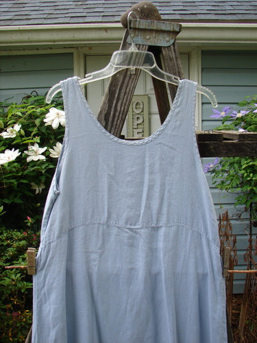 1999 Handkerchief Linen Sunbeam Dress Leaf Water Size 1 displayed on an outdoor swing, featuring a full-length sweeping skirt and empire waist seam, perfect for summer days.