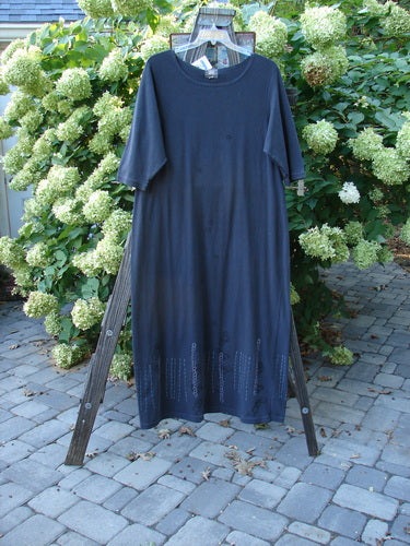 2001 NWT Tide Dress Celtic Knot Licorice Size 2 displayed on a rack, showcasing three-quarter length sleeves and a slightly flared lower hem, perfect condition with signature Junk Drawer and Celtic Knot theme paint.