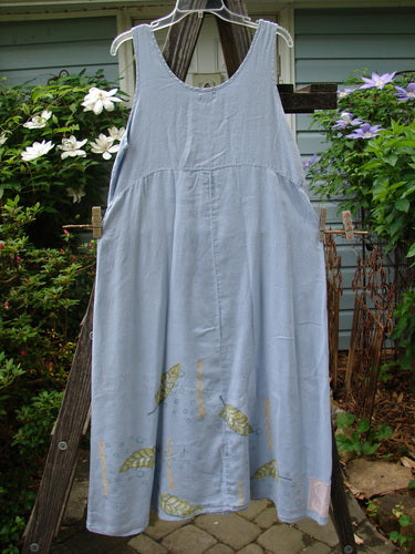 1999 Handkerchief Linen Sunbeam Dress Leaf Water Size 1 displayed on a wooden rack, showcasing a full-length sweeping skirt, empire waist seam, and sweet leaf theme paint.