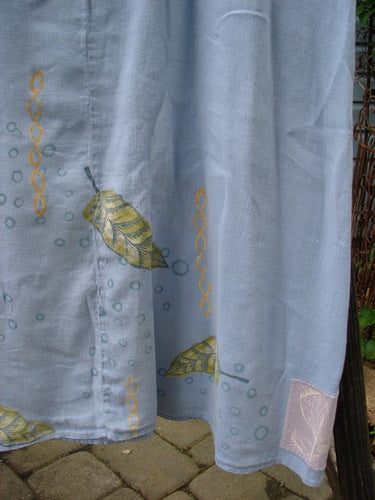 1999 Handkerchief Linen Sunbeam Dress Leaf Water Size 1: Close-up of a full-length dress with an empire waist and sectional panels, showcasing a sweet leaf theme paint.