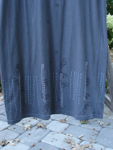 2001 NWT Tide Dress Celtic Knot Licorice Size 2 featuring a flared lower and three-quarter sleeves, displayed with chain pattern details on a blue fabric. Perfect for layering or as a simple dress.