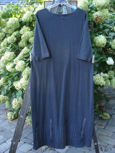 2001 NWT Tide Dress Celtic Knot Licorice Size 2 on a clothes rack, showcasing three-quarter sleeves and a slightly flared lower in perfect condition, ideal for layering or wearing alone.
