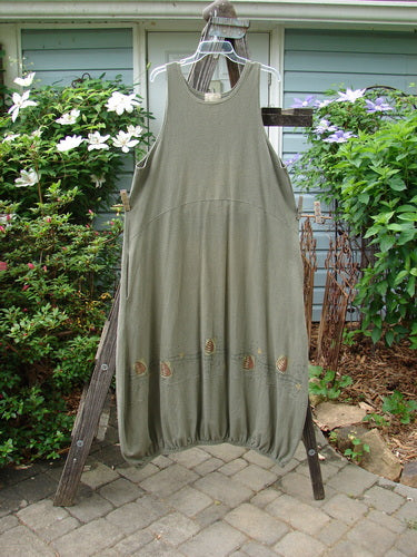 2000 Libby Jumper Honey Hive Loden Size 2 displayed on a wooden rack, showcasing its sophisticated drape, bubbled shape, side pockets, and bee-themed detailing.
