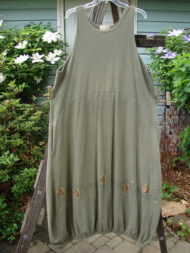 2000 Libby Jumper Honey Hive Loden Size 2 hanging on a clothesline, showcasing its sophisticated drape, downward scooped waistline, side pockets, and unique honey and beehive painted design.