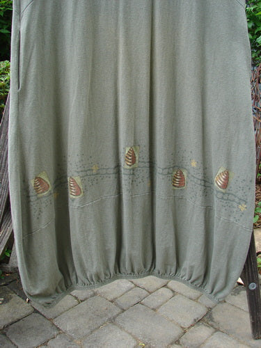 2000 Libby Jumper Honey Hive Loden Size 2 displayed on a rack, showcasing its downward scooped waistline, side pockets, lower bubbled shape, and honey bee hive theme with varying elastic hemline.