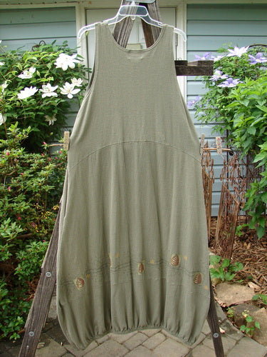 2000 Libby Jumper Honey Hive Loden Size 2 displayed on a clothes rack, showcasing its exquisite drape, downward scooped waistline, bubbled shape, and unique honey and bee hive theme.