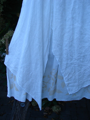 Barclay NWT Linen Fold Over Generosity Skirt Leaf Field Fresh White Size 2, showcasing the layered batiste design with a subtle vine pattern, clipped outdoors, highlighting its organic cotton and artistic detail.