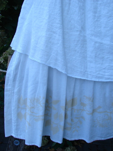 Barclay NWT Linen Fold Over Generosity Skirt features an off-white tiered design with faint vine motifs, showcasing a creative, vintage-inspired style, ideal for expressing individuality as seen at Bluefishfinder.com.