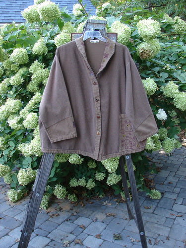 Barclay Patched Flannel Frolic Jacket Vine Garden Rock Size 2 displayed on a swinger, showcasing its ribbed corded outer, oversized front pocket, and sweet painted patches with a garden vine theme.