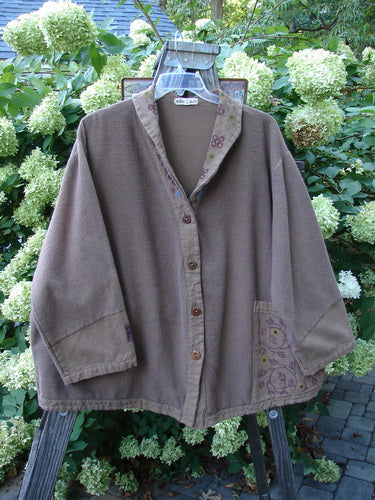 Barclay Patched Flannel Frolic Jacket Vine Garden Rock Size 2 displayed on a hanger, showcasing its ribbed corded outer, oversized front pocket, painted patches, and unique buttons.