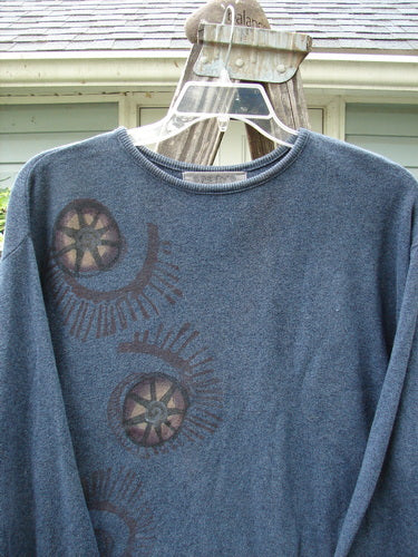 1997 Cotton Cashmere Crop Pullover Star Wheel Marled Blueprint Size 3 features blue fabric with painted wheel designs, slightly shorter boxy shape, drop shoulders, thin ribbed hemline, and rolled ribbed neckline.