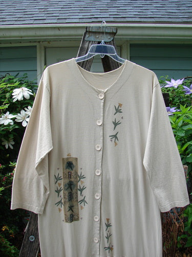 1994 Column Dress Magic Star Mist Size 2 features a full front button design, elongated paint theme, V-shaped neckline, longer sleeves, and a bottom kick flounce in mid-weight cotton.