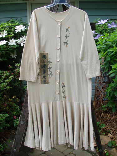 1994 Column Dress Magic Star Mist Size 2 featuring a ruffle hem, full front buttons, V-shaped neckline, longer sleeves, and a flounce bottom, highlighted by a star-themed design.