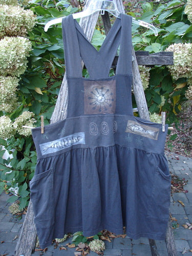 1995 Overall Jumper Fish Space Briquette OSFA features X-back straps, a fitted waistband with patch pockets, and a gathered skirt, adorned with playful fish and space-themed prints, capturing a vintage, artistic style.