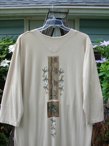 1994 Column Dress Magic Star Mist Size 2, featuring a full front button design, longer sleeves, V-shaped neckline, and a full bottom kick flounce, displayed on a wooden stand.
