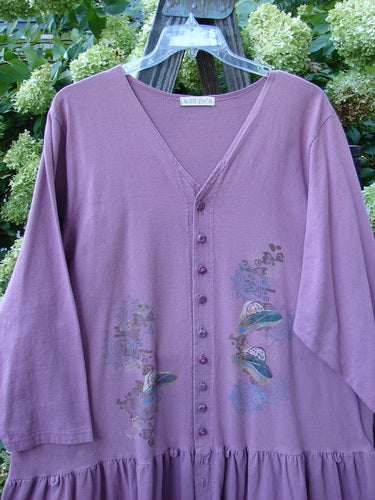 1997 Belladonna Jacket Pocketless Top Hat Crocus Size 2: A purple jacket with a whimsical top hat theme paint and a flirtatious bottom flounce. Made from organic cotton.