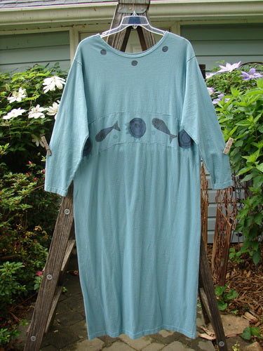 1995 Empire Dress Moon Fish Venus Size 2 on a wooden rack, showcasing a unique moon and fish theme, downward curved waist panel, and painted neckline.