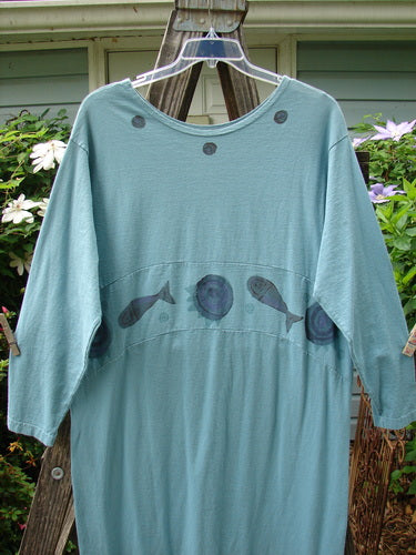 1995 Empire Dress Moon Fish Venus Size 2: Blue shirt-like dress with fish motif, downward curved waist panel, painted neckline, and narrowing elongated shape.