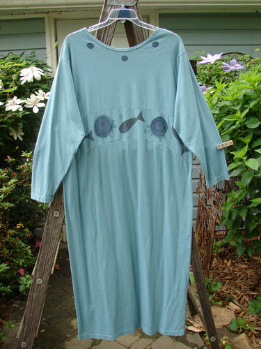1995 Empire Dress Moon Fish Venus Size 2 displayed outdoors, showcasing a downward curved upper waist panel, painted neckline, tighter lower sleeves, and rare moon and fish theme paint.