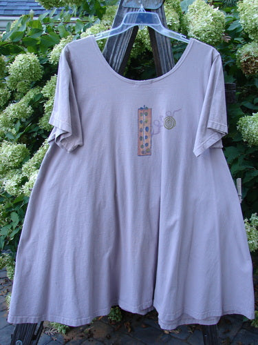 1995 Hop Scotch Dress with Wind Curl design on a clothes hanger