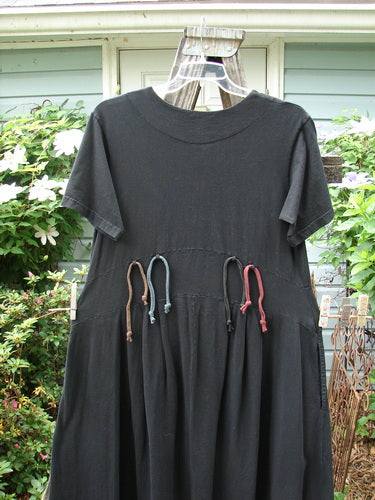 2000 LuLu's Dress Leaf Black Size 0: Organic cotton dress with pleated front darts, yoked waistline, two inseam pockets, button top closure, and leaf-themed detailing.