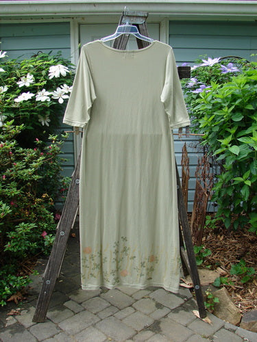 2001 Tide Dress Jax Kelp Size 1 displayed on a wooden ladder, showcasing its slightly flared lower, three-quarter length sleeves, and signature Jax theme paint.