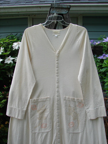 2001 T Snap Dress Game Pieces Fizz Size 1 with three-quarter sleeves, V-neckline, double-layered cuffs, and two front offset painted triangular pockets, featuring snap tape around the hem and front.