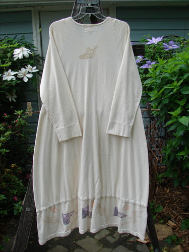 2001 T Snap Dress Game Pieces Fizz Size 1, featuring three-quarter length sleeves, a longer A-lined shape, and two front-painted triangular pockets, hanging on a clothesline outdoors.