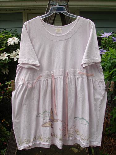 1999 Ribbon Dress Butterfly Orchid Size 2 hanging on a clothesline; features double-paneled rounded neckline, adjustable waistline, and butterfly-themed design.