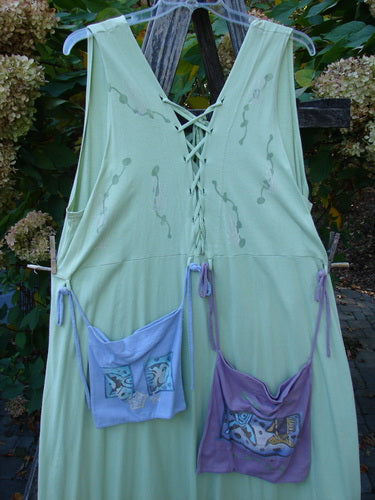 1997 Salt Water Taffy Jumper Sea Life Mellon Size 2 features a long, sleeveless pale-green dress with lace-up back, straight skirt, and two decorative fish-motif pouches, embodying vintage Blue Fish creativity.