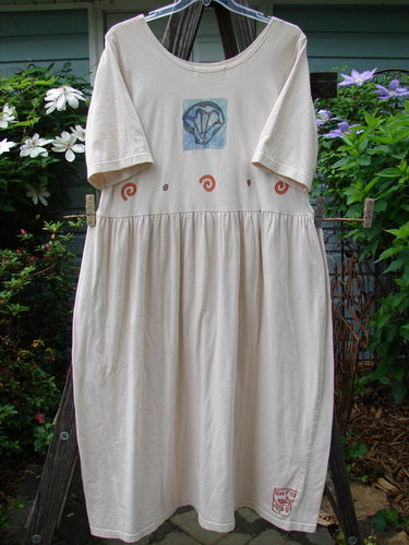 1996 Simple Dress Fish Birch Bark Size 2 hanging on a clothesline, showcasing a slightly deeper rounded neckline, drop empire waist seam, and signature Blue Fish stamp with a classic fish theme paint.