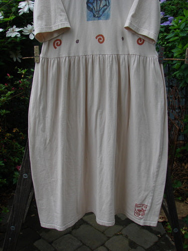 1996 Simple Dress Fish Birch Bark Size 2 hanging on a clothesline, showcasing its full sweeping skirt and gathered waistline fabric. Organic cotton with signature Blue Fish stamp and theme paint.