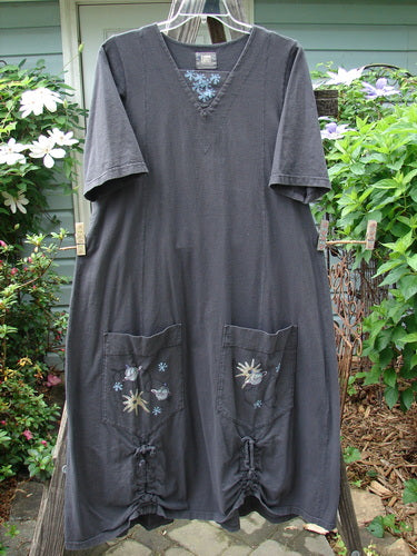 2000 Nova Dress Star Flower Orbit Size 0 on a rack, featuring a reverse triangular painted neckline, three-quarter wide sleeves, widening lower shape, giant side pockets, and vertical drawcord accents.
