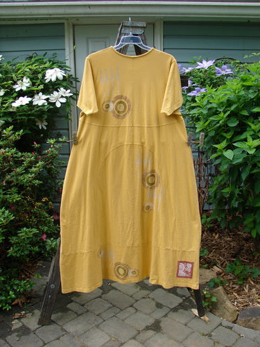 1998 Croquet Dress Lawn Games Lemonade Size 2 on a clothes rack, featuring a shallow rolled neckline, sectional vertical rounded panels, and unique front and back inserts.