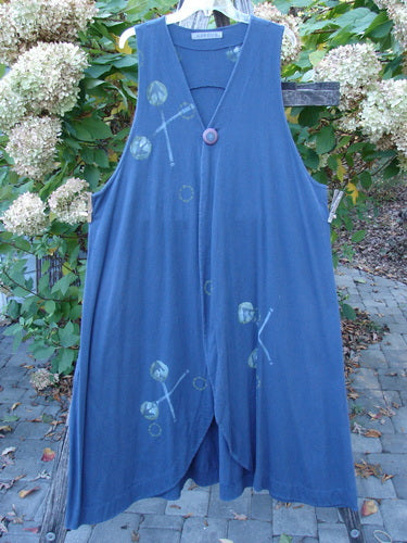 1996 State Fair Vest Directional Arrow Ridge Size 2, a loose-fitting, sleeveless blue dress with a V-neck, decorative button, front hem slit, and subtle circular/X-shaped print, showcasing vintage Blue Fish Clothing's unique style.